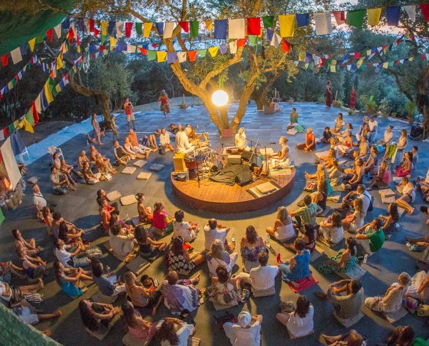 Arillas group of people enjoying song and meditation